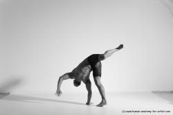 Underwear Gymnastic poses Man Black Muscular Bald Dancing Dynamic poses Academic